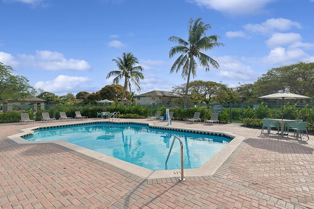Pool with landscaping at Running Brook Apartments in Miami FL